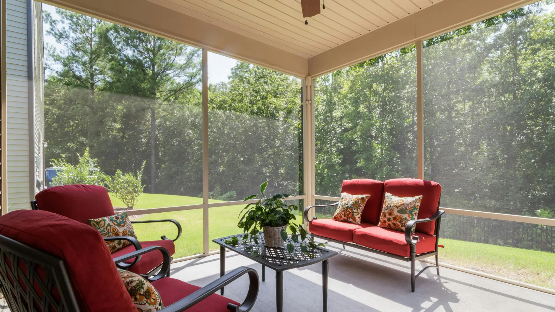 Clean screened patio enclosure with patio furniture — screen enclosure cleaning by Amazing You Cleaning