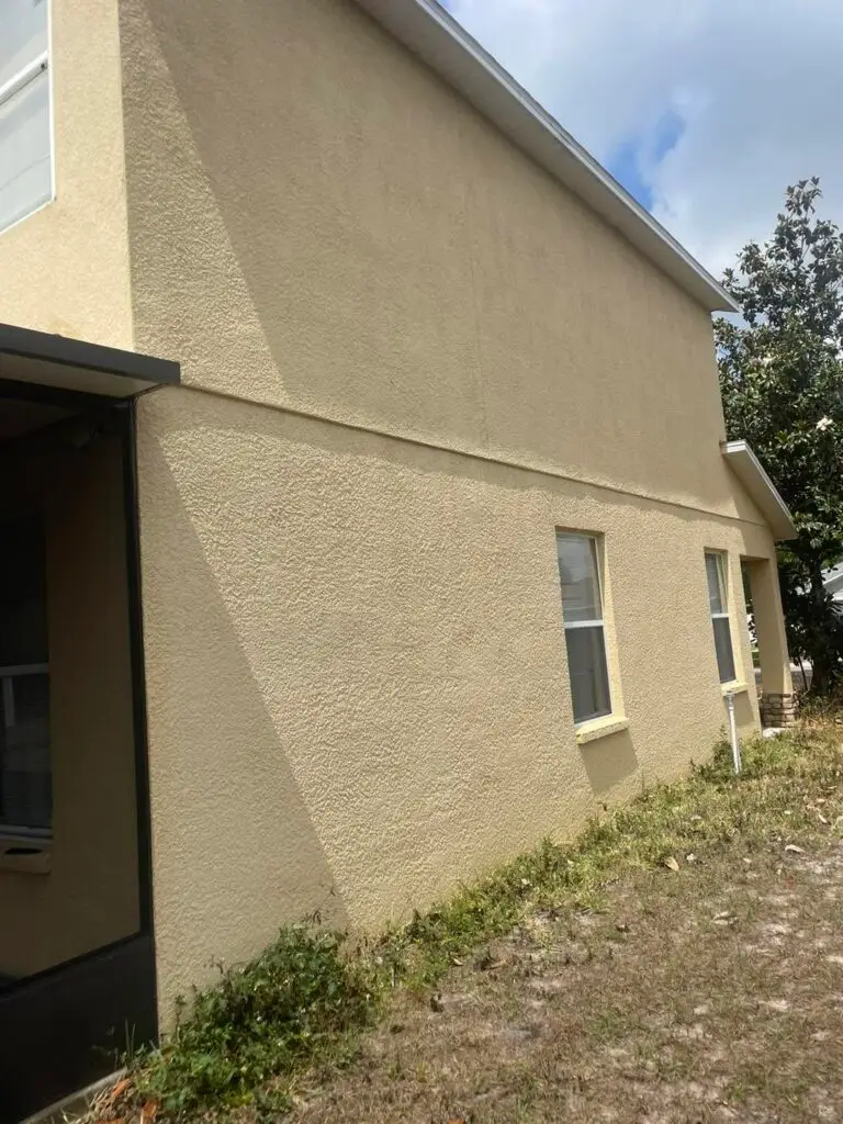 Home exterior after soft wash house washing by Amazing You Cleaning